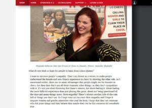 A screenshot of the interview with Jennifer Shahade. On the picture over the text we see Jennifer Shahade with red hair laughing and looking friendly. She's wearing a black blouse.